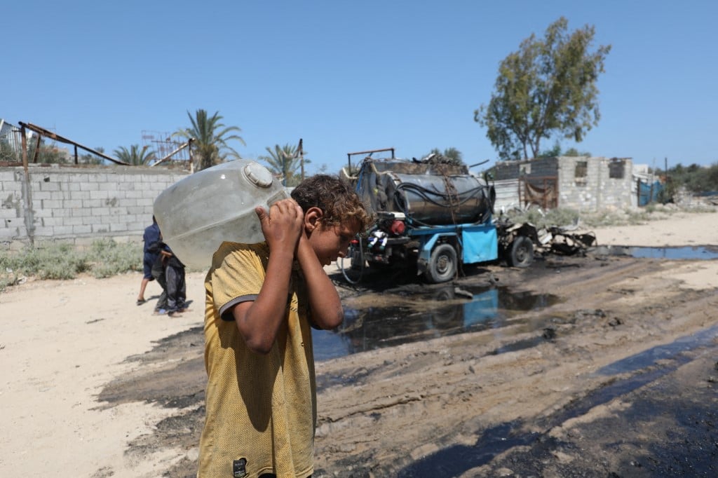 GAZA CITY, GAZA - JULY 14: A view of the unusable water tanker following the Israeli attacks on Nuseirat Refugee Camp in Gaza Strip on July 14, 2025. It was reported that the Israeli army targeted a tanker distributing water resulting in deaths and injuries. Moiz Salhi / Anadolu (Photo by MOIZ SALHI / ANADOLU / Anadolu via AFP)